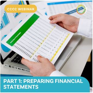 Picture of hands holding financial statement in front of laptop