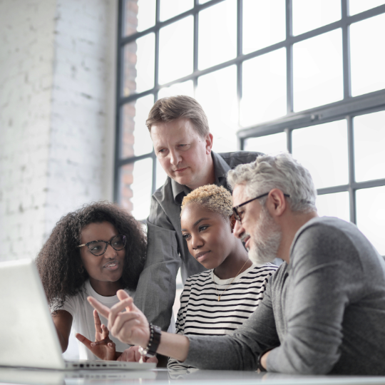 Picture of work colleagues looking at computer screen