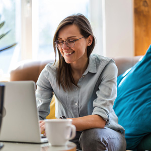 Picture of smiling woman using a laptop